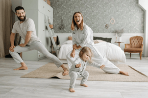 Family enjoying yoga in freshly washed clothes pulled from their Norman dryer.